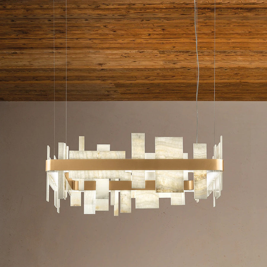 Modern chandelier with gold accents hanging against a wooden ceiling by Masiero available at Spacio retail stores in Mumbai & Kolkata. 