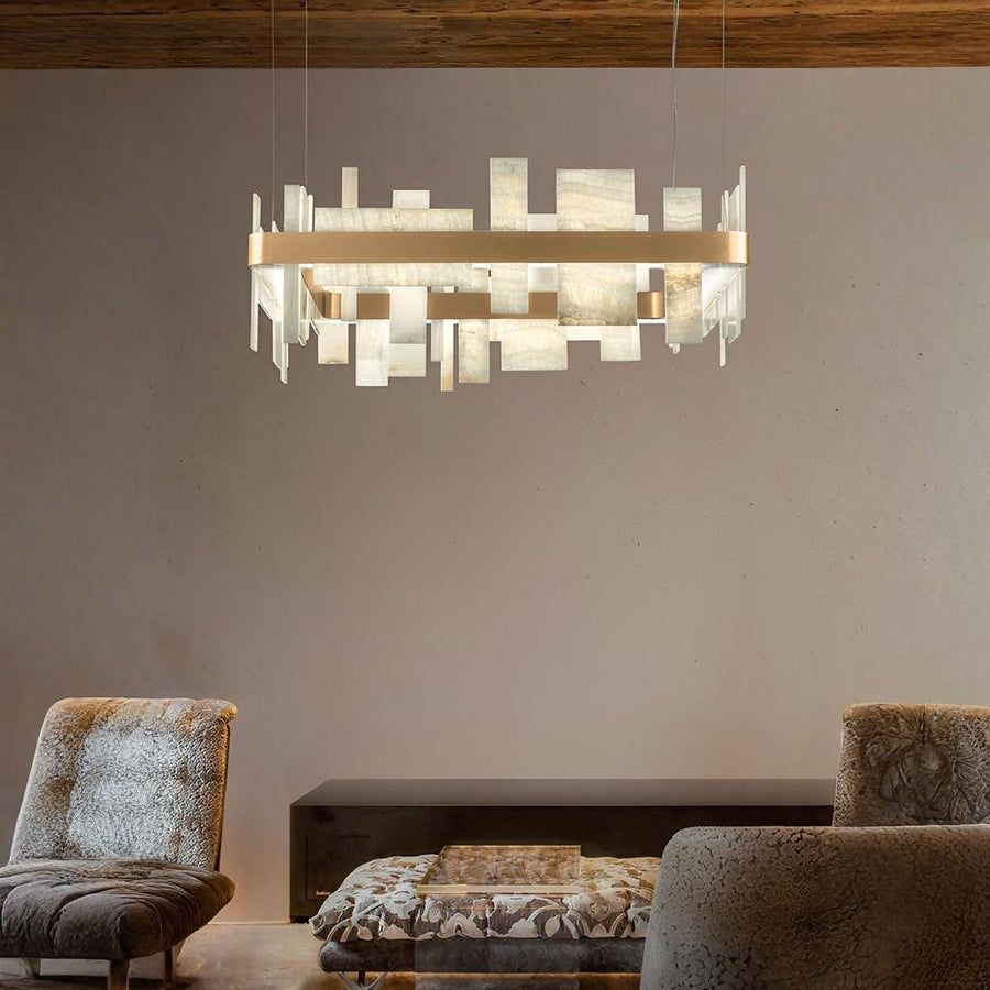 Modern chandelier hanging above a living room with two armchairs and a coffee table by Masiero available at Spacio retail stores in Mumbai & Kolkata. 