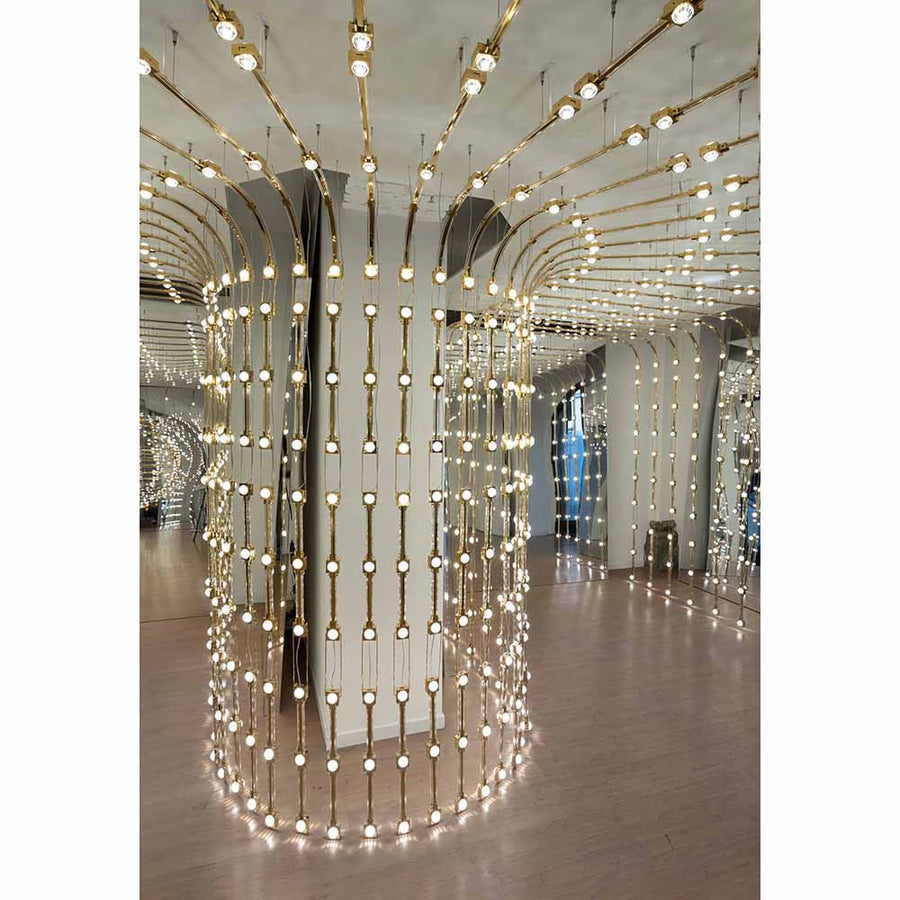Decorative interior with hanging lights and reflective surfaces