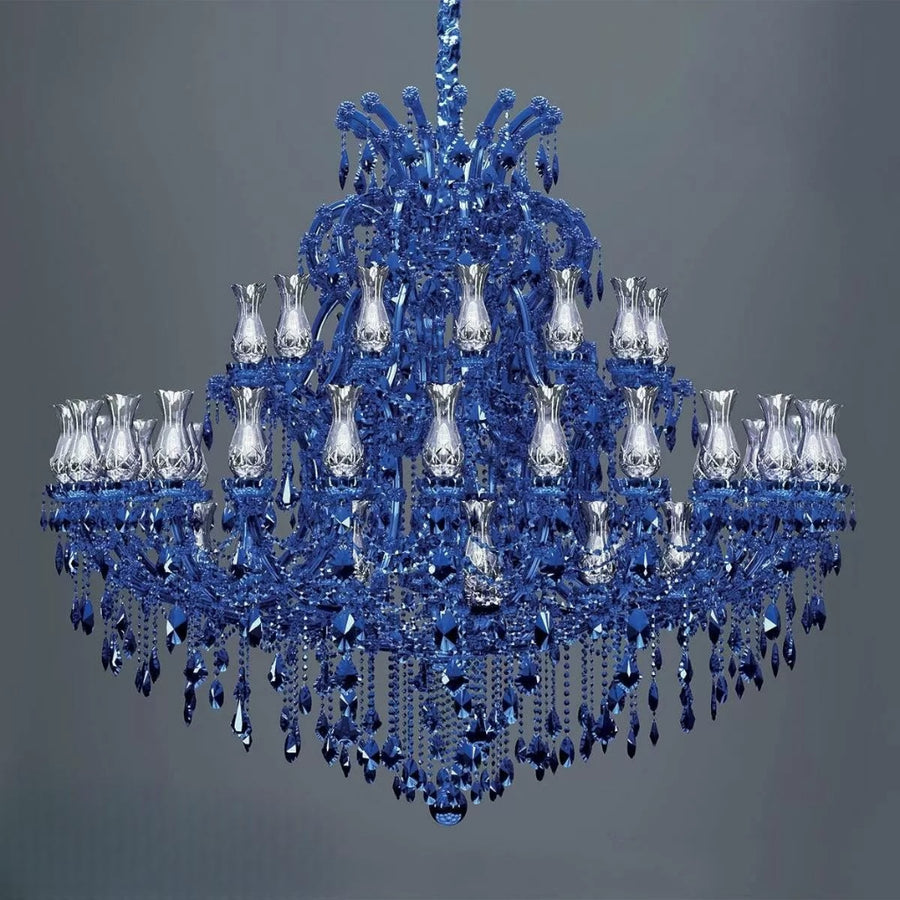 Blue classic chandelier by Masiero with clear crystals on a gray background available at Spacio in India. 