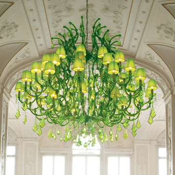 Classic Green crystal chandelier hanging in a room with white walls and windows by Masiero