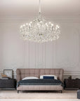Luxurious bedroom with a large crystal chandelier by Masiero from Spacio