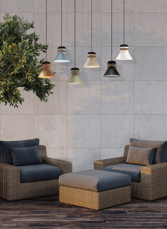 Outdoor furniture set with wicker chairs and ottoman against a tiled wall with hanging pendant lights.