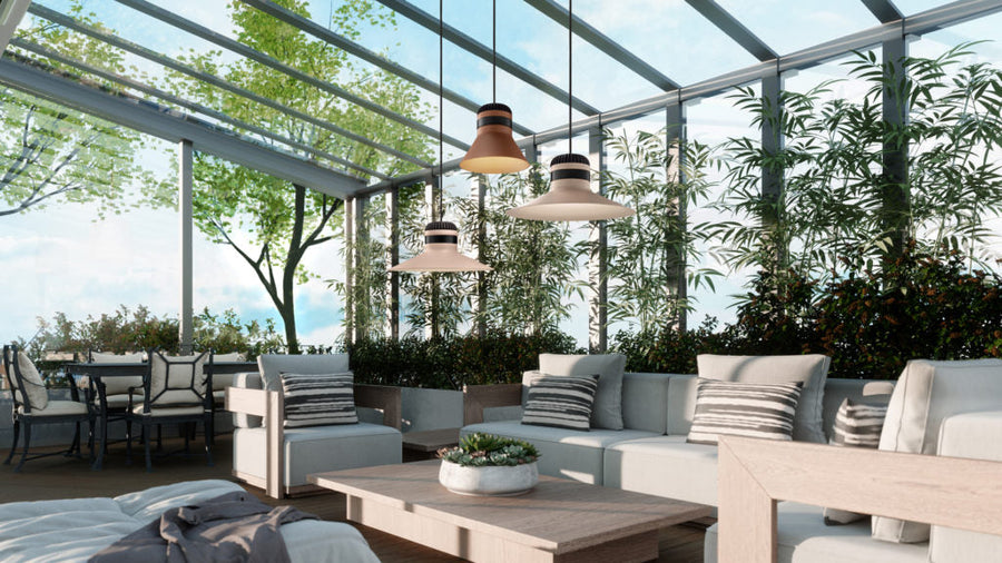 Modern outdoor patio with furniture, plants, and hanging lights.
