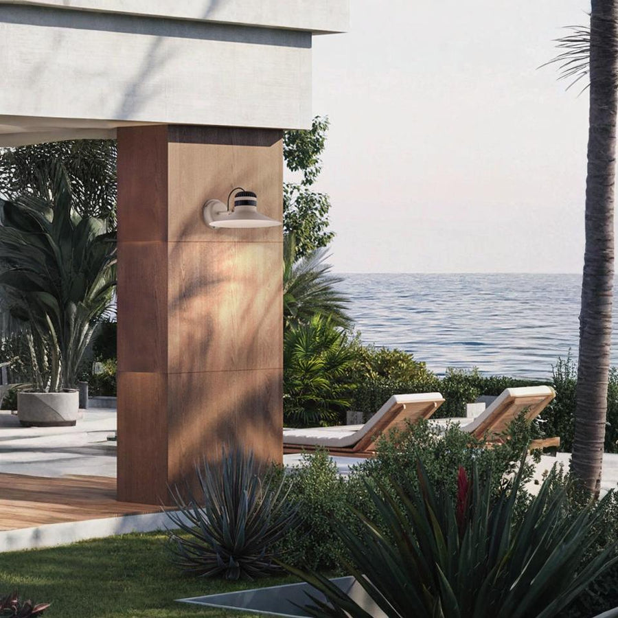Ocean view and lounge chairs with Masiero's Cordea outdoor light on the wall in white colour
