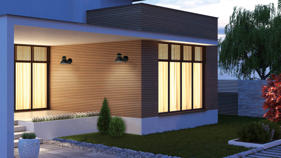 Modern house exterior with illuminated windows at night