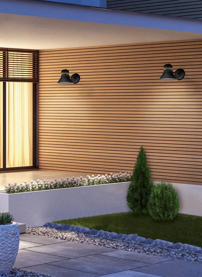 Modern outdoor setting with wooden wall, garden, and lighting fixtures.