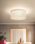 Ceiling crystal light fixture in a room with decorative elements from Masiero