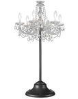 Outdoor crystal chandelier from Masiero's Drylight collection on a black stand against a white background