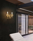 Outdoor Gold wall sconce on a dark wall with a modern interior setting