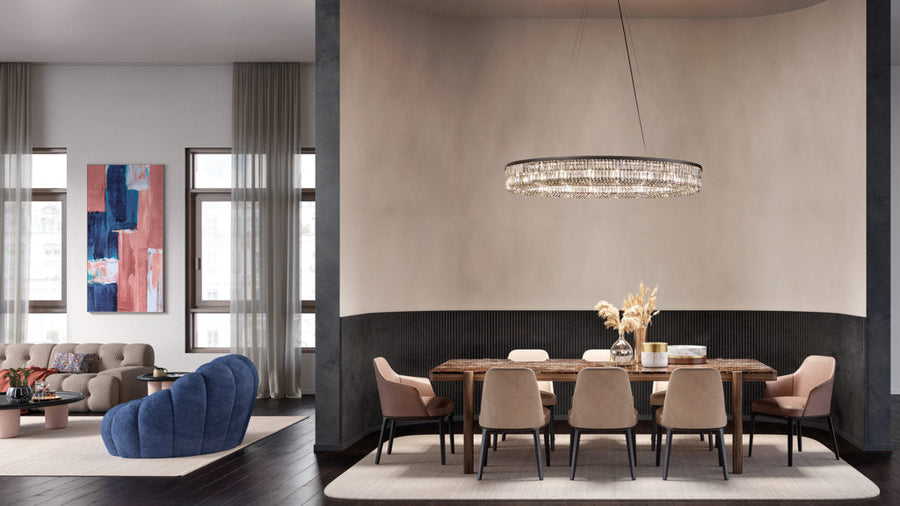 Modern dining room with a table, chairs, and a crystal chandelier from Masiero available at Spacio retail stores in India.