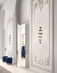 Luxurious interior with ornate wall designs and decorative lighting fixtures.