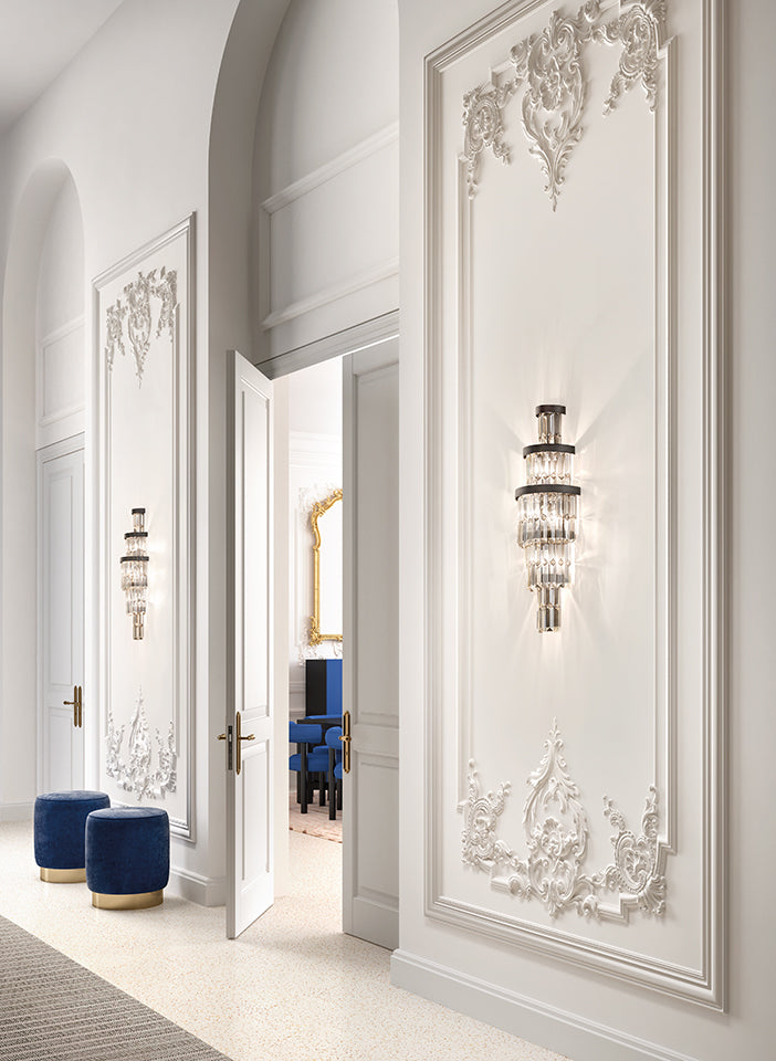 Luxurious interior with ornate wall designs and decorative lighting fixtures.