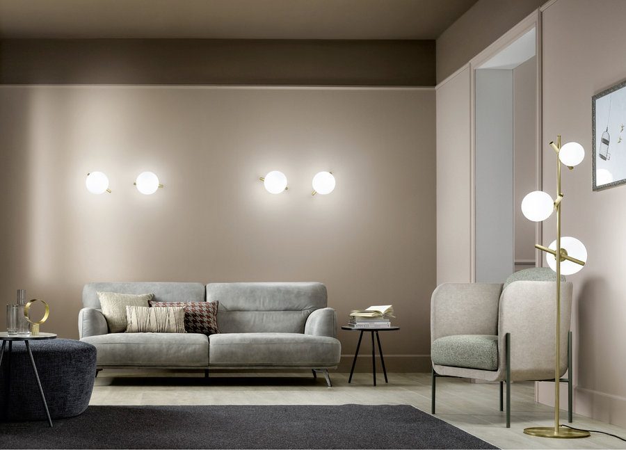 A living room showcasing the simplicity of Masiero Posy Collection, beige walls and a grey couch, creating a balanced ambiance. Styled by Spacio Interior Styling team
