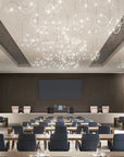 Modern conference room with ceiling lights and tables arranged for meetings.