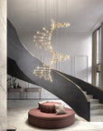 Modern staircase with a decorative chandelier in a stylish interior setting.