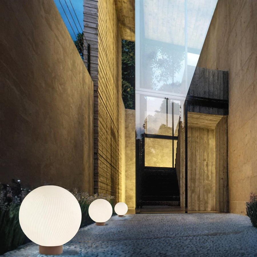 Modern architectural entrance with spherical outdoor lights from Masiero