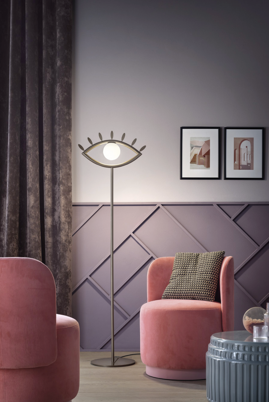 A luxury living room with the Eye shaped floor lamp from Masiero Visio Collection with pink interiors styled by Spacio Interior Styling team