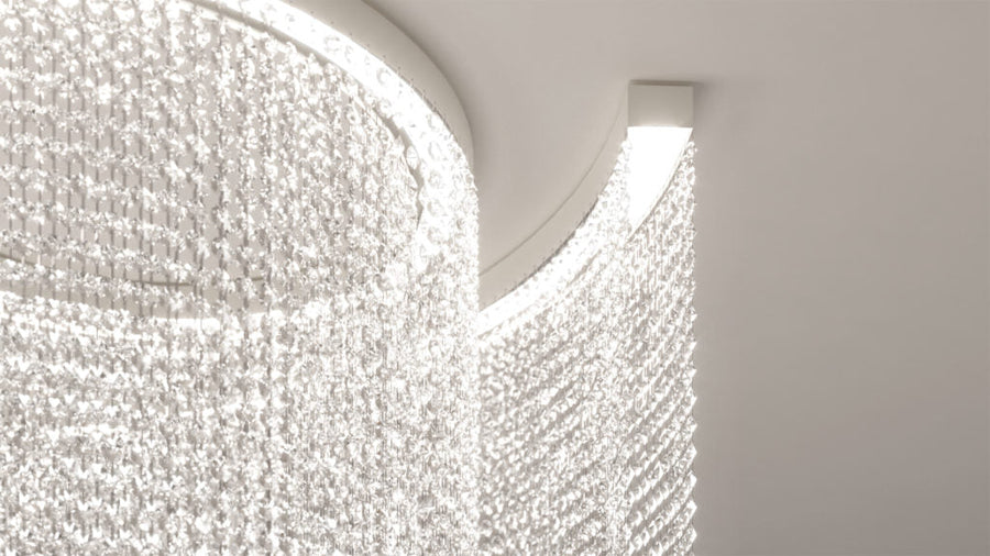 Close-up of a modern ceiling light fixture with a white, textured design.