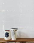 Sophisticated white Meystyle Squares Illusions of Entropy LED Wallpaper from UK, showcasing subtle illuminated geometric patterns, exclusively at Spacio India.