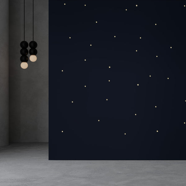 Meystyle Stars Boutique LED Wallpaper in deep midnight blue with warm LED lighting, creating a celestial ambiance. Available at Spacio India.