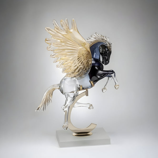 Glass sculpture of a Pegasus on a gray background from Murano studio available at Spacio retail store in Mumbai. 