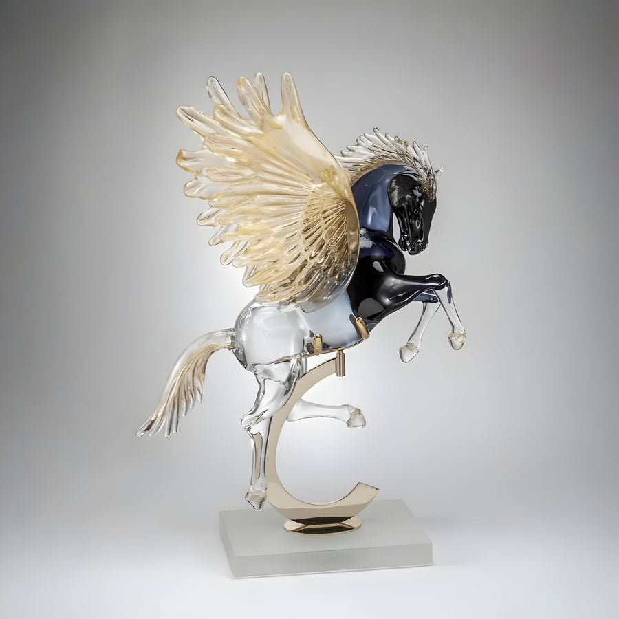 Glass sculpture of a Pegasus on a gray background from Murano studio available at Spacio retail store in Mumbai. 