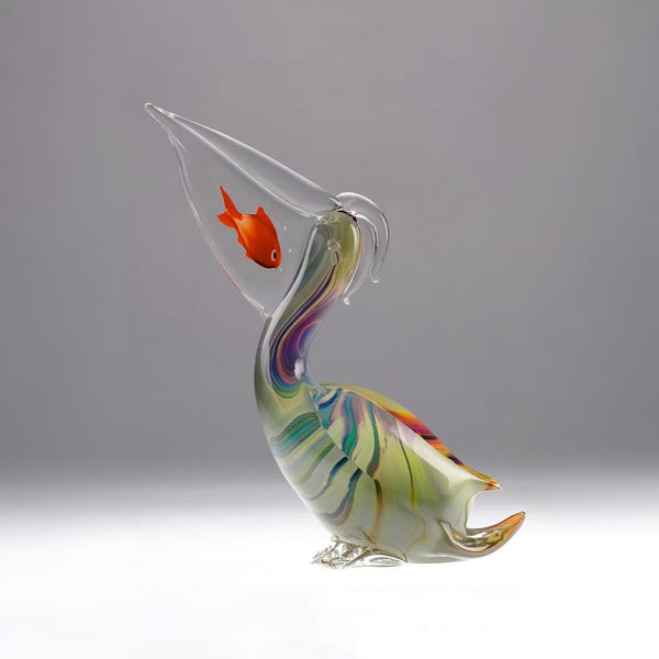 Colorful Murano glass sculpture of a fish with a conical head on a gray background by Zanetti at Spacio retail store in Mumbai