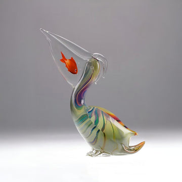 Colorful Murano glass sculpture of a fish with a conical head on a gray background at Spacio retail store in Mumbai