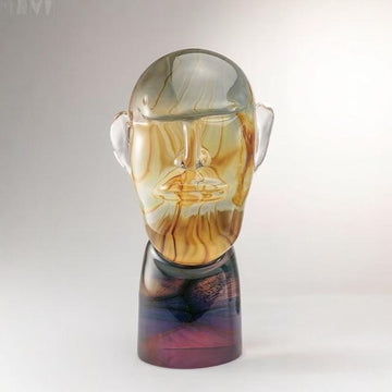 Murano Glass sculpture of a face with a gradient color effect on a white background