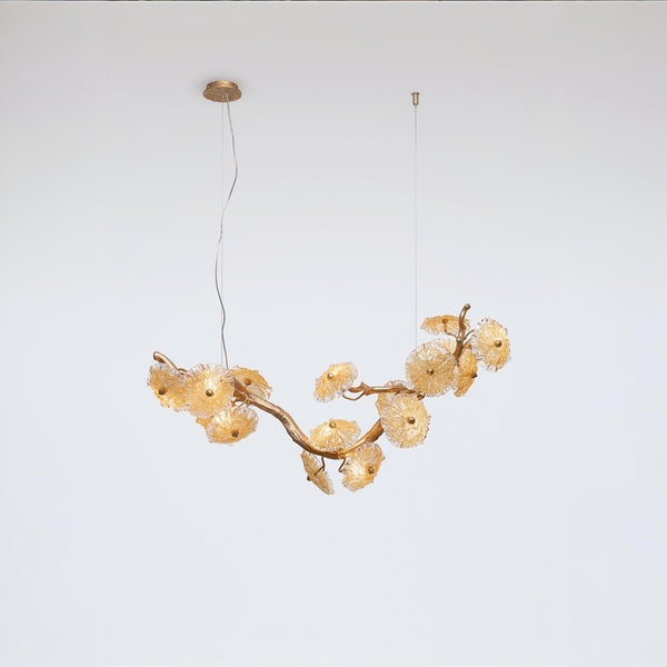 Gold chandelier with floral design on a white background