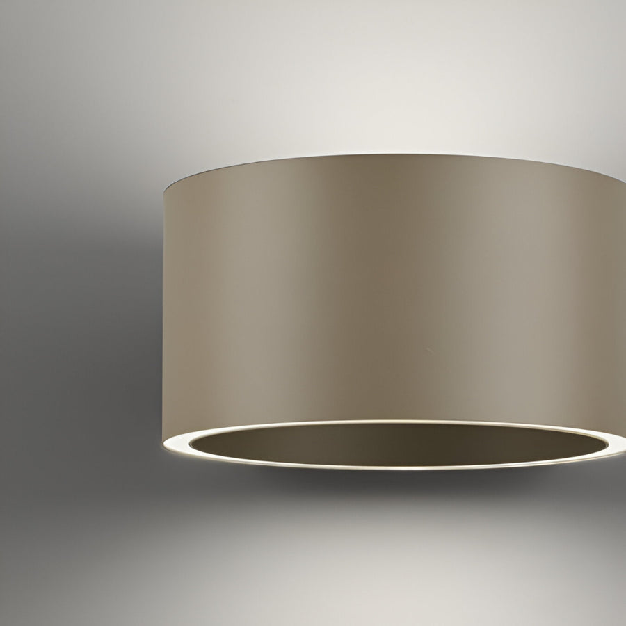 Beige cylindrical light fixture on a gray background