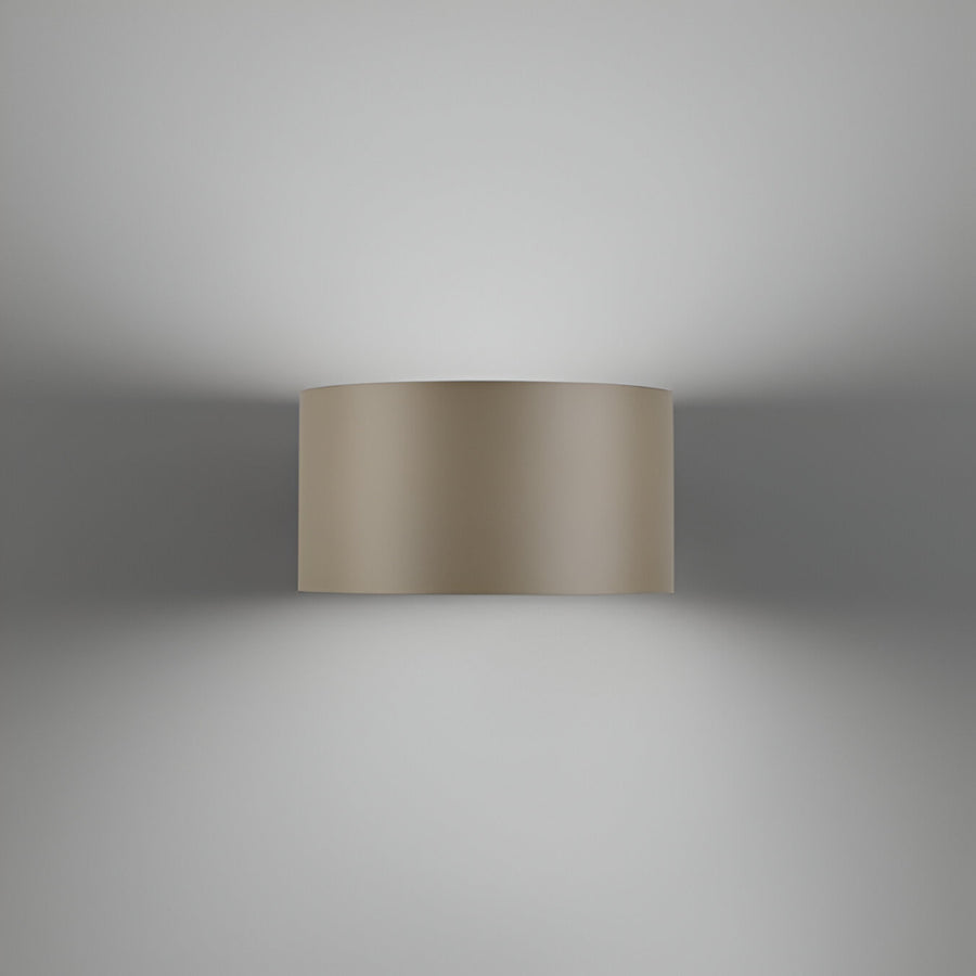 Beige cylindrical wall light fixture on a gray background