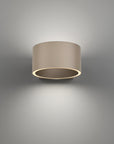 Cylindrical wall light fixture on a gray background