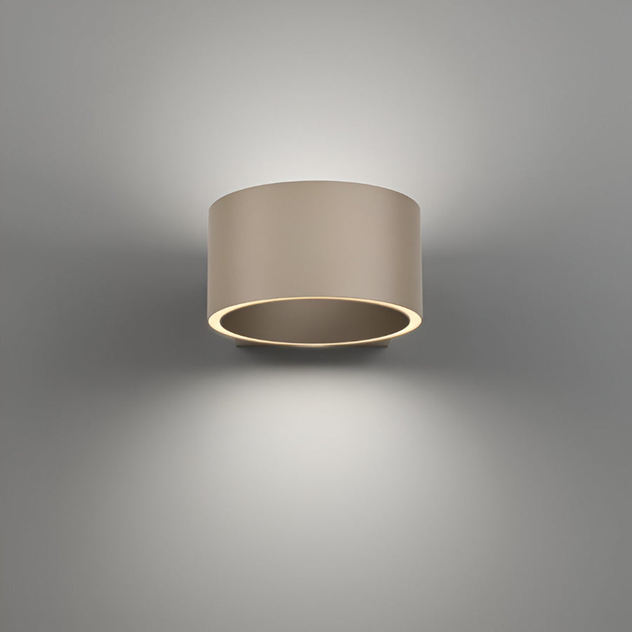 Cylindrical wall light fixture on a gray background