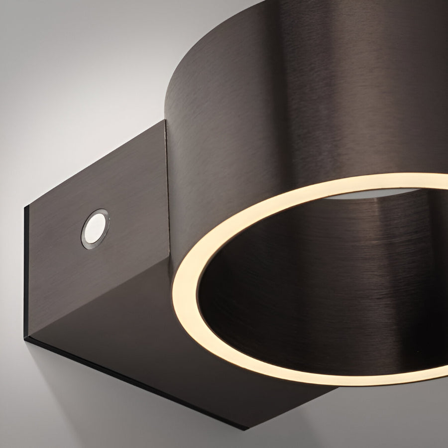 Modern wall-mounted rechargeable light fixture with a metallic finish on a gray background