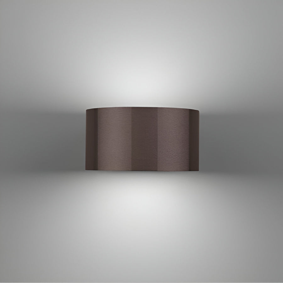 Cylindrical brown rechargeable light fixture on a gray background