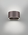 Cylindrical wall rechargeable light fixture on a gray background