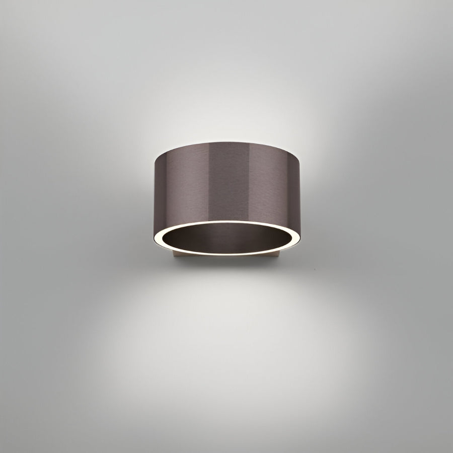 Cylindrical wall rechargeable light fixture on a gray background