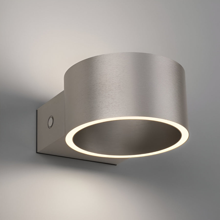 Modern wall-mounted rechargeable light fixture on a gray background