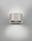 Cylindrical wall rechargeable light fixture on a gray background