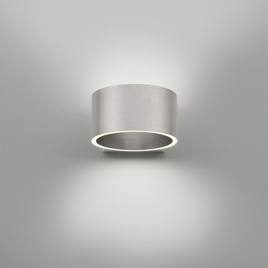 Cylindrical wall rechargeable light fixture on a gray background