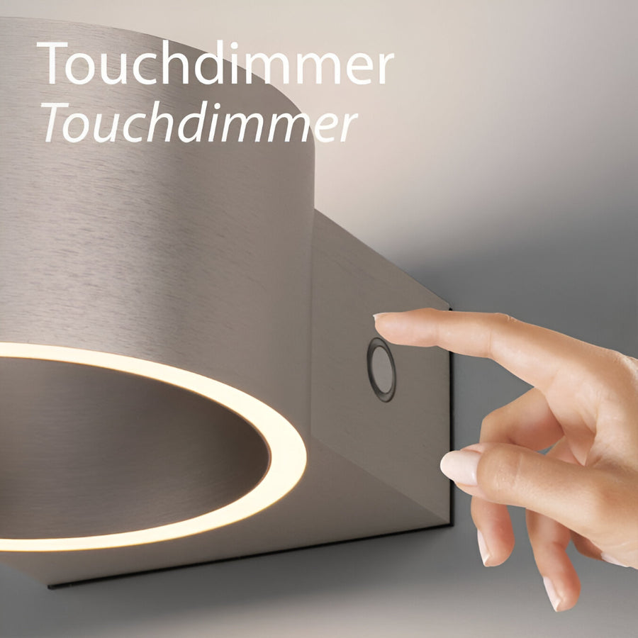 Hand touching a touchdimmer switch on a rechargeable light fixture with 'Touchdimmer' text.