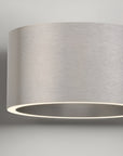 Modern ceiling light fixture with a gray shade on a neutral background