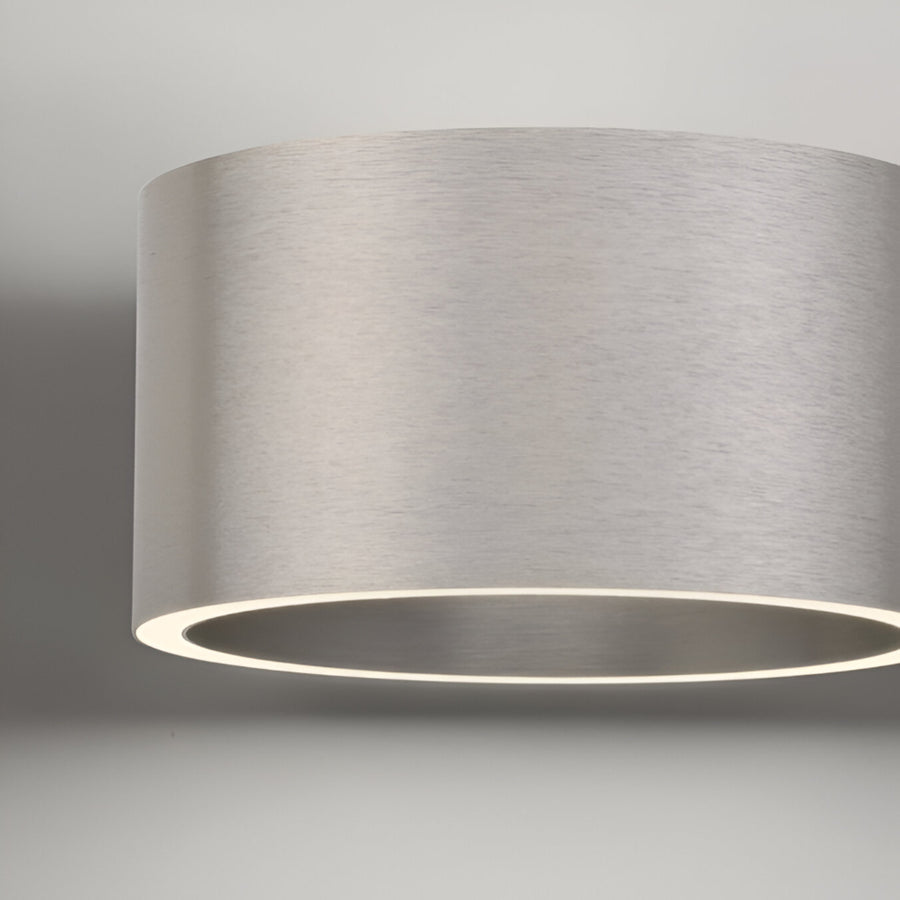 Modern ceiling light fixture with a gray shade on a neutral background