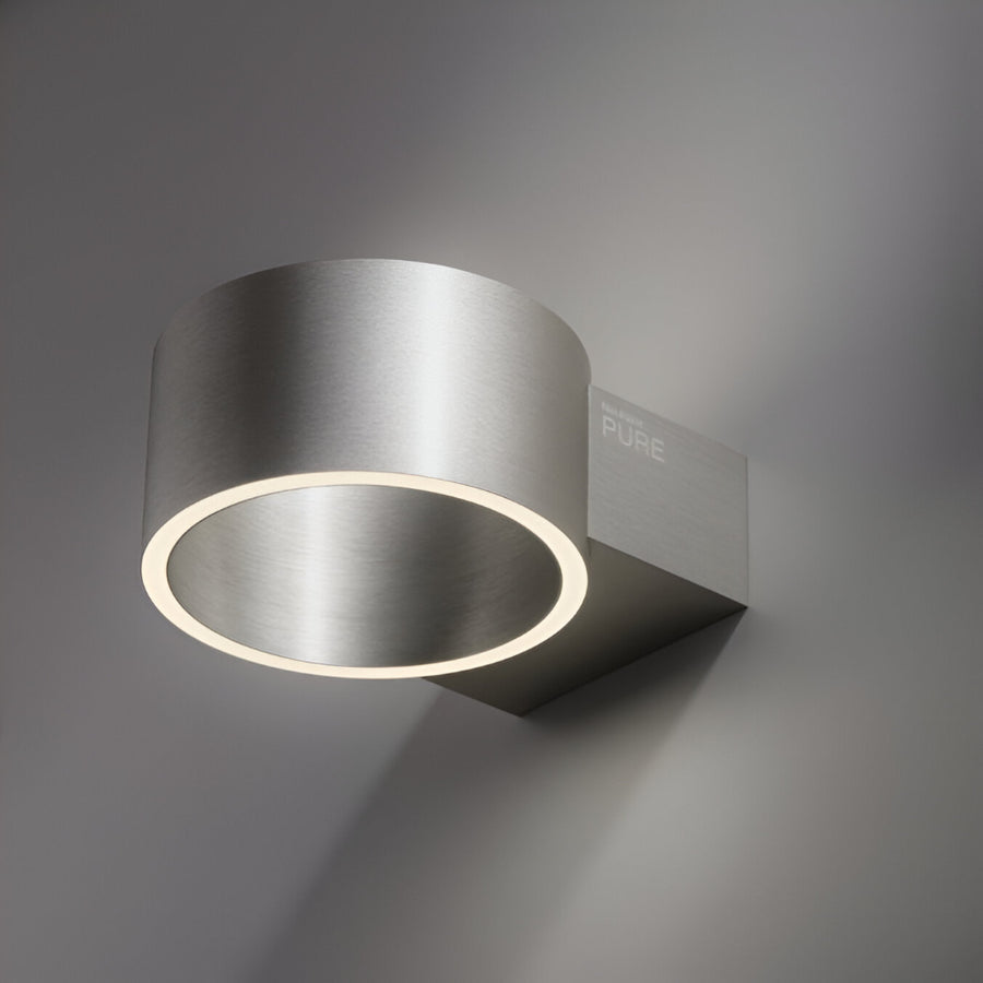 Modern wall-mounted light fixture with 'PURE' branding on a gray background