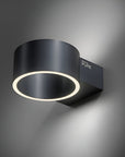 Modern black wall rechargeable light fixture with a ring of light on a dark background
