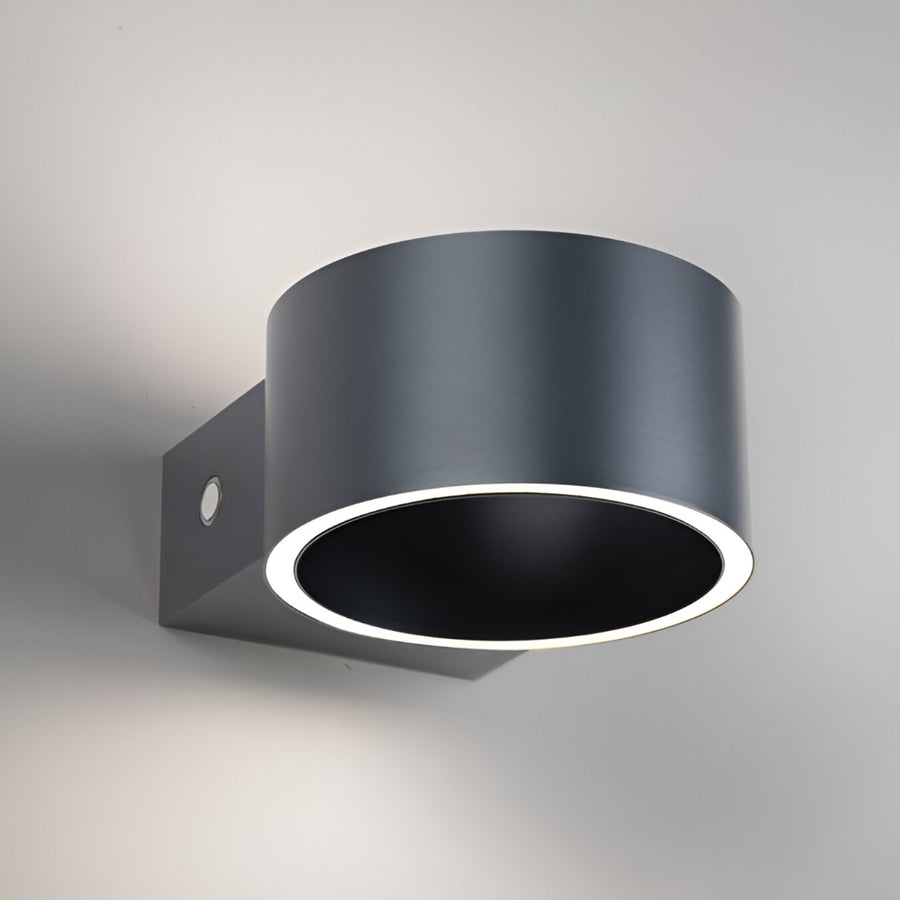 Black wall-mounted rechargeable light fixture on a gray background