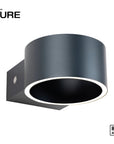 Black wall rechargeable light fixture with 'Neuhaus Pure' branding on a white background