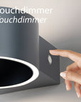 Touchdimmer rechargeable wall light fixture with a hand pressing the dimmer button.